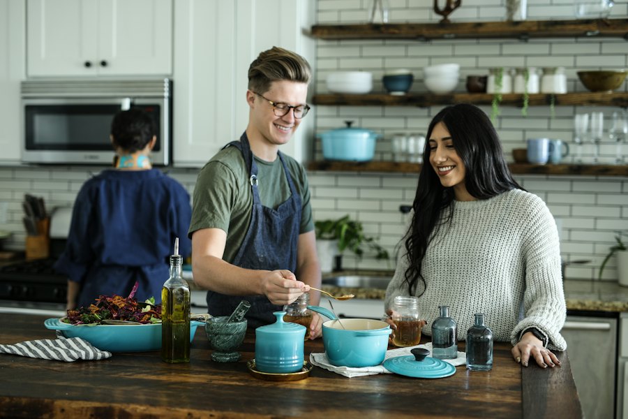 Friends cooking together in the kitchen