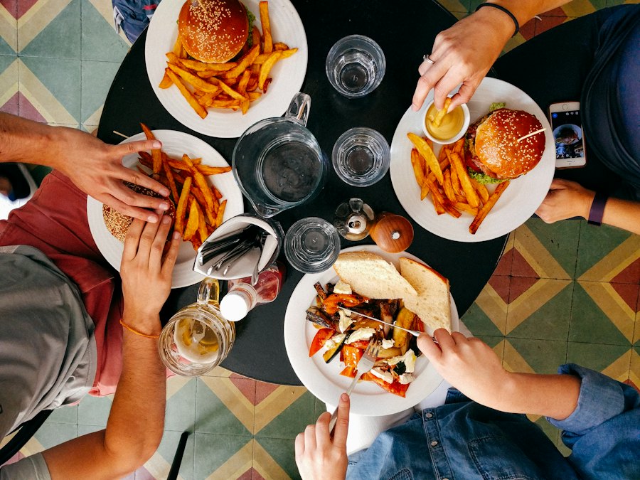Friends sharing burgers and fries