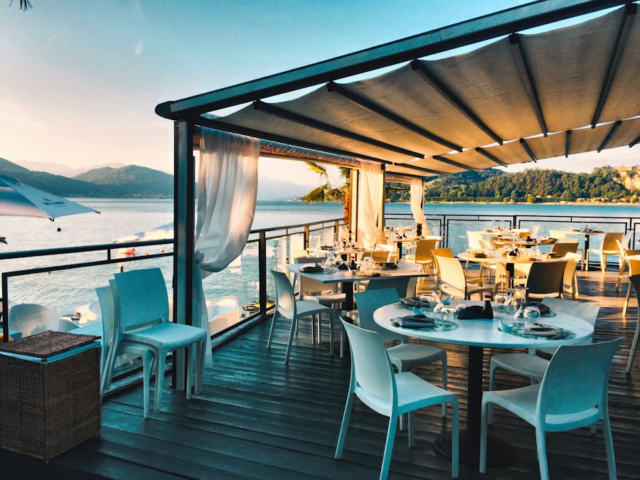 Open-air terrace seating at sunset