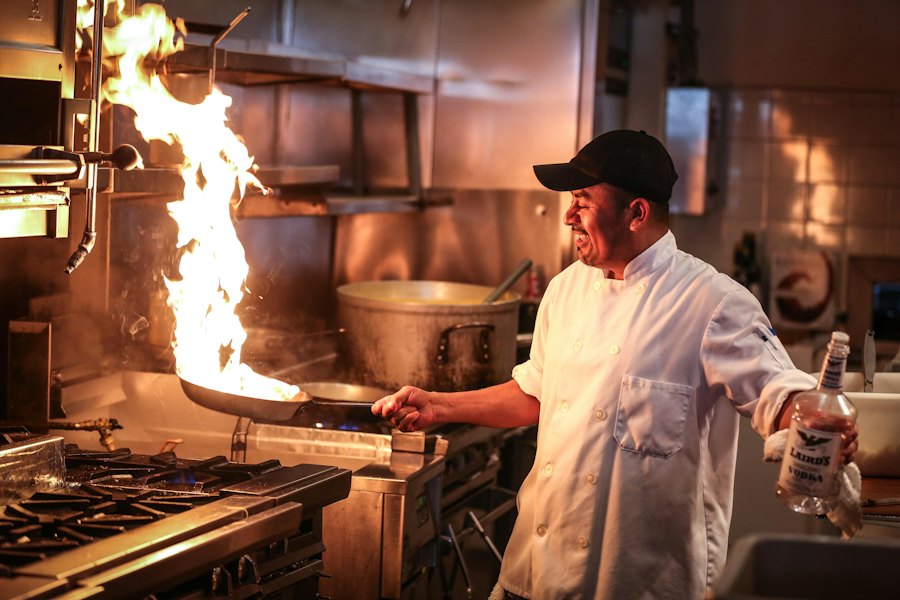 Chef tossing a flaming wok